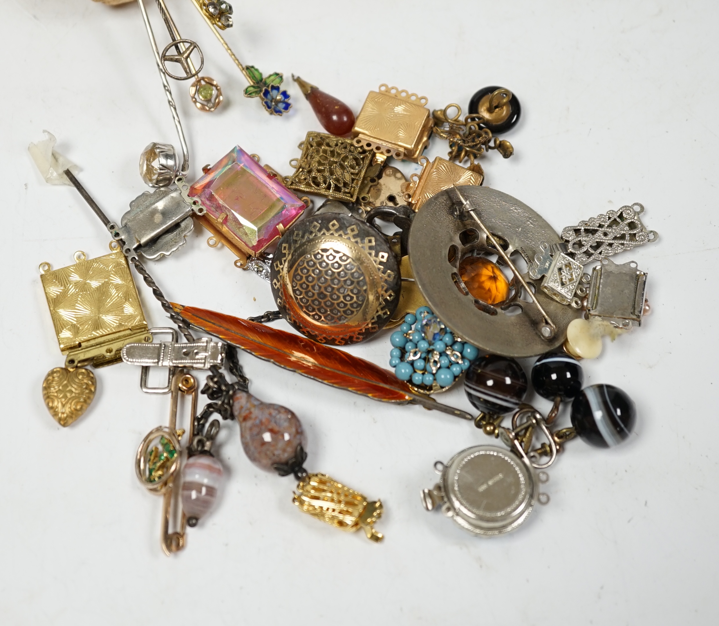 A small quantity of early 20th century and later jewellery, including a diamond chip set white metal pendant, an agate set hair? ornament and a 9ct and gem set anchor bar brooch, banded agate drop ear clips, stick pins,